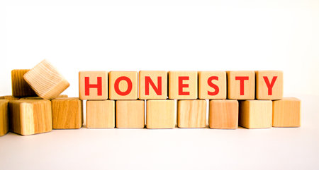 Honesty word symbol. Concept word Honesty on beautiful wooden blocks. Beautiful white background. Business honesty concept. Copy space.の写真素材