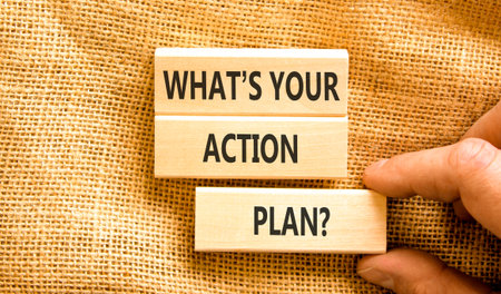 What is your action plan symbol. Concept words What is your action plan on beautiful blocks. Beautiful canvas background. Businessman's hand. Business what is your action plan concept. Copy space.の写真素材
