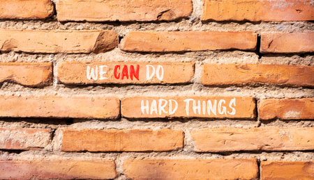 Support, help we can do hard things symbol. Concept words We can do hard things on beautiful brick...