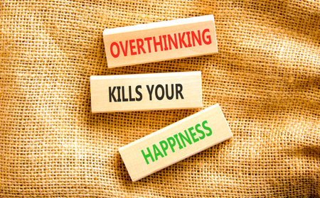 Overthinking kills your happiness symbol. Concept words Overthinking kills your happiness on wooden blocks. Beautiful canvas background. Business overthinking kills happiness concept. Copy space.の写真素材