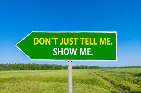 Tell or show symbol. Concept words Do not just tell me, show me beautiful green road sign. Beautiful...