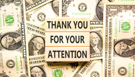 Thank you for your attention symbol. Concept words Thank you for your attention on beautiful wooden blocks. Beautiful dollar bills background. Business thank you for your attention concept. Copy spaceの写真素材