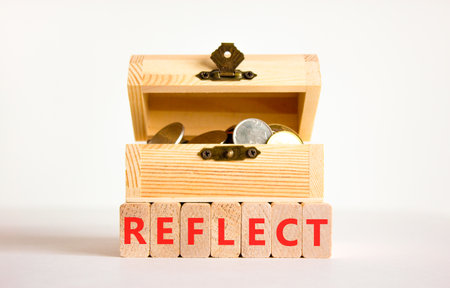 Reflect word symbol. Concept word Reflect on beautiful wooden blocks. Beautiful white background. Beautiful wooden chest with coins. Business psychological reflect word concept. Copy space.の写真素材