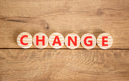 Change symbol. Concept word Change on beautiful wooden circles. Beautiful wooden background. Business change concept. Copy space.の写真素材