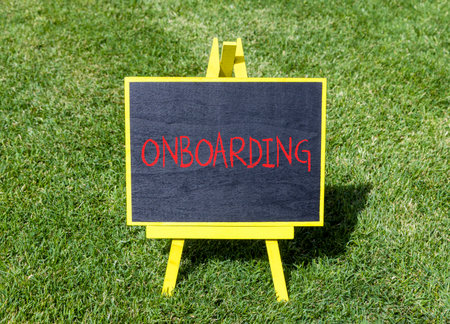 Onboarding success symbol. Concept word Onboarding on beautiful black blackboard. Beautiful green...
