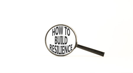 How to build resilience symbol. Concept words How to build resilience on beautiful magnifying glass. Beautiful white background. Business how to build resilience concept. Copy space.の写真素材