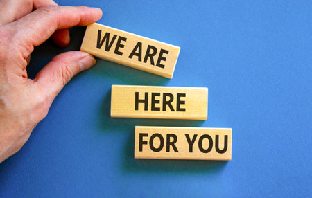 Support, help and we are here for you symbol. Concept words We are here for you on beautiful blocks....