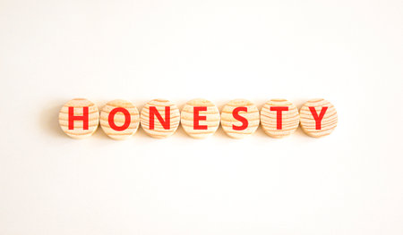 Honesty word symbol. Concept word Honesty on beautiful wooden circles. Beautiful white background. Business honesty concept. Copy space.の写真素材