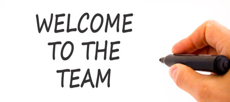 Support, help welcome to the team symbol. Concept words Welcome to the team on beautiful paper. Beautiful white background. Businessman's hand. Business welcome to the team concept. Copy space.の写真素材