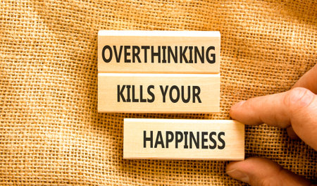 Overthinking kills your happiness symbol. Concept words Overthinking kills your happiness on wooden blocks. Beautiful canvas background. Business overthinking kills happiness concept. Copy space.の写真素材
