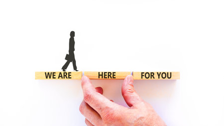 Support, help and we are here for you symbol. Concept words We are here for you on beautiful blocks. Beautiful white background. Businesswoman's icon. Business we are here for you concept. Copy space.の写真素材