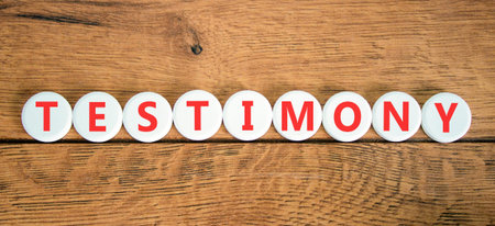 Testimony symbol. Concept word Testimony on beautiful white circles. Beautiful wooden background....