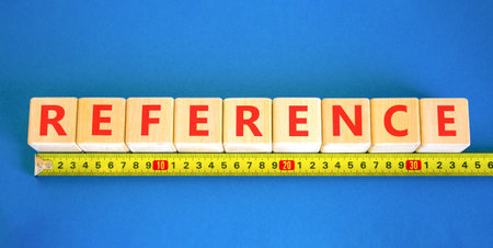 Resilience symbol. Concept word Resilience on wooden blocks. Blue background. Yellow ruler. Business...