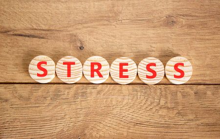 Stress word symbol. Concept word Stress on beautiful wooden circles. Beautiful wooden background. Business psychological medical stress word concept. Copy space.の写真素材