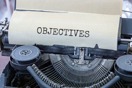 Objectives symbol. Concept Objective words typed on beautiful old retro typewriter. Beautiful white...