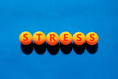 Stress word symbol. Concept word Stress on beautiful orange table tennis ping pong balls. Beautiful...