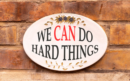 Support, help we can do hard things symbol. Concept words We can do hard things on beautiful sign plate. Beautiful brick wall background. Business we can do hard things concept. Copy space.の写真素材