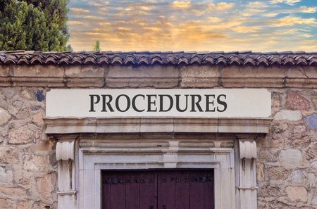 Procedures symbol. Concept word Procedures on beautiful white marble sign plate. Beautiful ancient stone wall and sunset background. Business procedures concept. Copy space.の写真素材