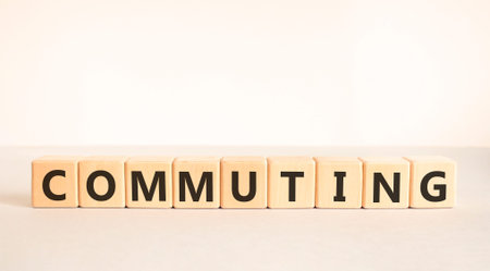 Commuting symbol. Concept word Commuting on beautiful wooden blocks. Beautiful white and gray background. Business education commuting concept. Copy space.の写真素材