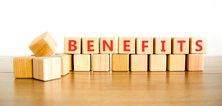 Benefits word symbol. Concept word Benefits on beautiful wooden blocks. Beautiful wooden table white background. Business support help benefits word concept. Copy space.の写真素材