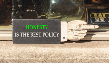 Honesty is the best policy on beautiful wooden black sign. Beautiful store front background. Business honesty is the best policy concept. Copy space.の写真素材