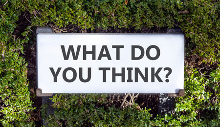 Support, help what do you think symbol. Concept words What do you think on white beautiful road sign. Beautiful green trees background. Business what do you think concept. Copy space.の写真素材