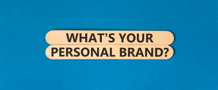 What is your personal brand symbol. Concept words What is your personal brand on beautiful wooden sticks. Beautiful blue background. Business what is your personal brand concept. Copy space.の写真素材