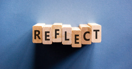 Reflect word symbol. Concept word Reflect on beautiful wooden blocks. Beautiful blue background. Business psychological reflect word concept. Copy space.の写真素材