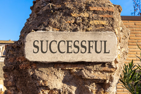 Successful symbol. Concept word Successful on beautiful white marble sign plate. Beautiful ancient brick wall background. Business successful concept. Copy space.の写真素材