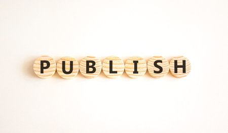 Publish word symbol. Concept word Publish on beautiful wooden circles. Beautiful white background....