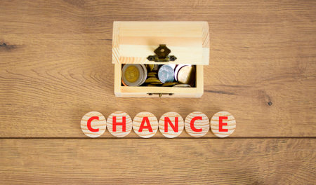 Chance symbol. Concept word Chance on beautiful wooden circles. Beautiful wooden background. Beautiful wooden chest with coins. Business chance concept. Copy space.の写真素材