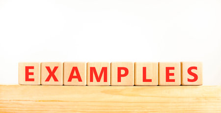 Example examples symbol. Concept word Examples on beautiful wooden blocks on wooden beam. Beautiful...