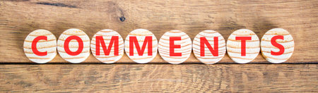 Comments comment word symbol. Concept word Comments on beautiful wooden circles. Beautiful wooden background. Business support help comments comment word concept. Copy space.の写真素材