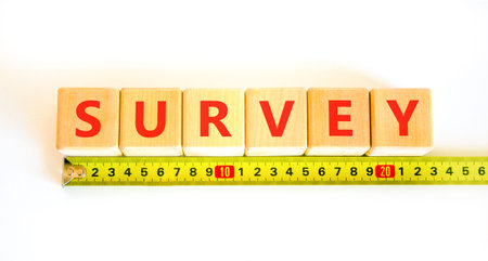 Survey word symbol. Concept word Survey on beautiful wooden blocks. Beautiful white background....