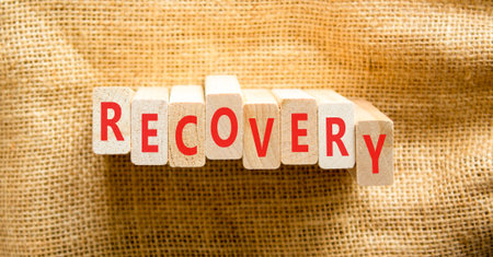 Recovery word symbol. Concept word Recovery on beautiful wooden blocks. Beautiful canvas background....