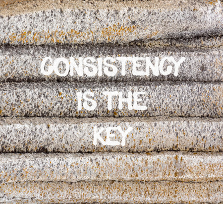 Consistency is the key symbol. Concept words Consistency is the key on beautiful gray mountain....