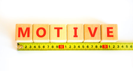 Motive support help symbol. Concept word Motive on beautiful blocks. Beautiful white background. Beautiful yellow tape measure ruler. Business psychological motive support and help concept. Copy spaceの写真素材