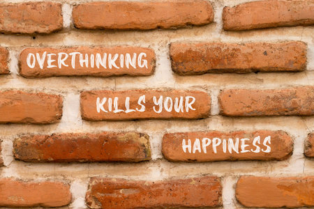 Overthinking kills your happiness symbol. Concept words Overthinking kills your happiness on brick wall. Beautiful brick wall background. Business overthinking kills happiness concept. Copy space.の写真素材