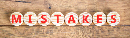 Mistakes word symbol. Concept word Mistakes on beautiful wooden circles. Beautiful wooden background. Business support help mistakes mistake word concept. Copy space.の写真素材