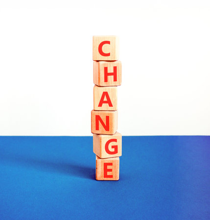 Change symbol. Concept word Change on beautiful wooden blocks. Beautiful blue and white background. Business change concept. Copy space.の写真素材