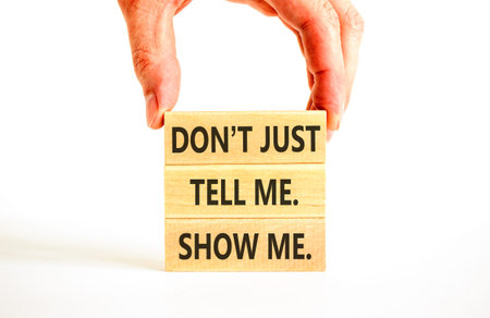 Tell or show symbol. Concept words Do not just tell me, show me on beautiful wooden blocks....