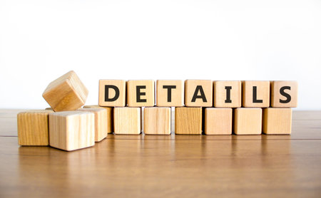 Details detail symbol. Concept word Details on beautiful wooden blocks. Beautiful wooden table white...
