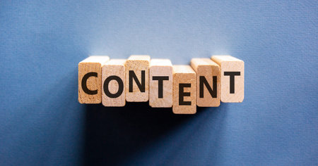 Content symbol. Concept word Content on beautiful wooden blocks. Beautiful blue background. Business content concept. Copy space.の写真素材