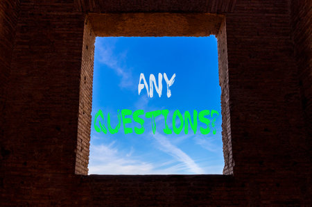 Any questions symbol. Concept words Any questions on beautiful blue sky in window in ancient wall....