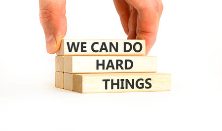 Support, help we can do hard things symbol. Concept words We can do hard things on beautiful wooden...