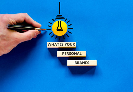 What is your personal brand symbol. Concept words What is your personal brand on beautiful wooden blocks. Beautiful blue background. Business what is your personal brand concept. Copy space.の写真素材