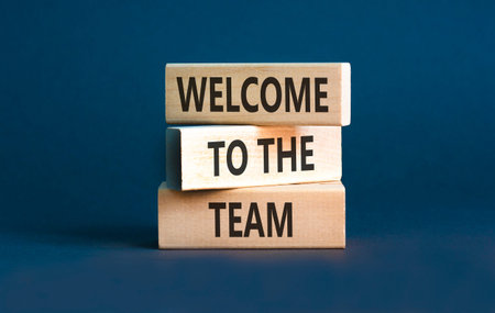 Support, help welcome to the team symbol. Concept words Welcome to the team on beautiful wooden blocks. Beautiful grey background. Business welcome to team concept. Copy space.の写真素材