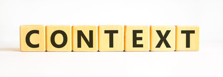 Context symbol. Concept word Context on beautiful wooden blocks. Beautiful white background....