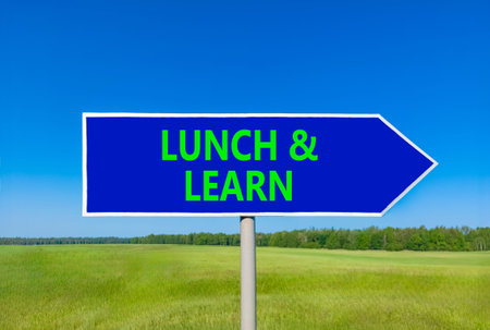 Lunch and learn symbol. Concept words Lunch and learn on beautiful blue road sign. Beautiful blue...
