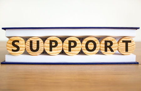 Support help word symbol. Concept word Support on beautiful wooden circles in book. Beautiful wooden...